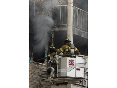 Edmonton Fire Rescue Services firefighters battle a blaze at Westridge Estates in Edmonton on Thursday, February 16, 2017. Ian Kucerak / Postmedia