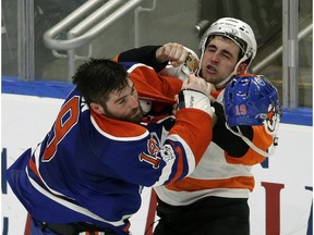 Edmonton Oilers Patrick Maroon (left) and Philadelphia Flyers Brandon Manning (right) fight during second period NHL hockey game action in Edmonton on Thursday February 16, 2017. (PHOTO BY LARRY WONG/POSTMEDIA) Photos off Oilers game for copy in Friday, Feb. 17 editions.