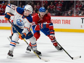 Connor McDavid #97 of the Edmonton Oilers skates the puck against Jeff Petry #26 of the Montreal Canadiens during the NHL game at the Bell Centre on February 6, 2016 in Montreal. The Oilers play the Canadiens on Sunday.