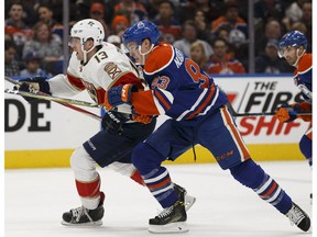 Edmonton's Ryan Nugent-Hopkins (93) races Florida's Mark Pysyk (13) during the first period of a NHL game between the Edmonton Oilers and the Florida Panthers at Rogers Place in Edmonton, Alberta on Wednesday, January 18, 2017.