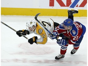 Edmonton's Trey Fix-Wolansky collides with Brandon's Reid Duke during a previous meeting this season. (File)