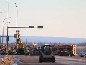 Emergency workers at the scene of a collision involving five vehicles and one semi-truck at the corner of Highway 63 and MacKenzie Boulevard on Saturday, February 11, 2017.