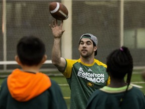 The Edmonton Eskimos' Neil King runs a drill as 200 children from Free Footie take part in an Edmonton Eskimos flag football camp at the Commonwealth Recreation Centre, in Edmonton on Wednesday Dec. 21, 2016. Free Footie is a not-for-profit organization dedicated to ensuring kids Grades 3 to 6 can participate in sports.