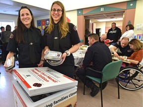 Fire department dispatchers Allison Secord, left, and Caryn Halstead spearheaded the Meals That Mend: Frozen Edition in Edmonton, which launched Wednesday, Feb. 15, 2017.