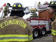 Edmonton Fire Fighters climb onto the roof of Fire Station #2 (10217 107 St.) as they start their annual Rooftop Campout to raise awareness and funds in support of Muscular Dystrophy Canada, in Edmonton Tuesday, Feb. 21, 2017. The firefighters will stay on the rood until Friday, Feb. 24, 2017.