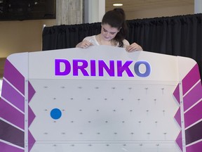 Contestant Marina Banister tries her hand at Drinko. The Alberta Gaming and Liquor Commission launched the game board on Feb. 15, 2017 as apart of its DrinkSense campaign, intended to educate participants on the importance of drinking in moderation.