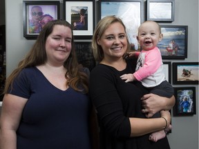 Heather Chaput (left) was surrogate mother to Sarah and Jason Geisler's (not pictured) baby, Everly, 9, months.