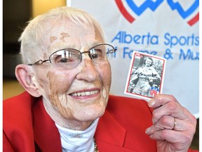 Holding a copy of her 1945 baseball card from the All American Girls Professional Baseball League on Monday, Feb. 27, 2017, Betty Carveth Dunn, 91, will be one of 11 athletes, along with one team, to get inducted into the Alberta Sports Hall of Fame this year, which is its 60th anniversary. (Ed Kaiser)