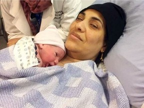 Ibtesam Alkarnake poses with baby Eyad after giving birth at the Northern Lights Regional Health Centre on Wednesday, Feb. 1, 2017. The Alkarnake family had arrived in Canada the night before from a refugee camp in Jordan.