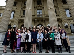 Minister of Seniors and Housing Lori Sigurdson, front centre, with Alberta's Daughters of the Vote delegates before they head to Ottawa for International Women's Day, on the steps of the Alberta Legislature, in Edmonton Friday Feb. 17, 2017.
