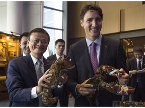 Alibaba chairman Jack Ma and Prime Minister Justin Trudeau hold lobsters during an announcement at Alibaba headquarters in Hangzhou, China, last September.
