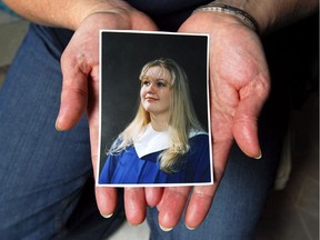 Karen Collier holds in her hands a photograph of her daughter Sharla, who was murdered five years ago on November 16.
