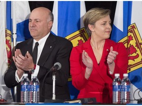 Kellie Leitch, right, and Kevin O'Leary applaud at the Conservative leadership candidates' debate, in Halifax on Saturday, Feb. 4, 2017. Conservatives vote for a new party leader on May 27, 2017.
