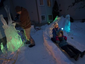 Sherwood Park Kelly Davies has taken leftover ice and created a 12-metre slide for his children Anna, 7, and Julia, 4.