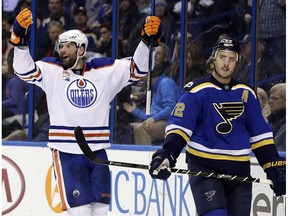 Edmonton Oilers forward Patrick Maroon celebrates after scoring as St. Louis Blues' Kevin Shattenkirk skates past on Dec. 19, 2016, in St. Louis. (AP Photo)