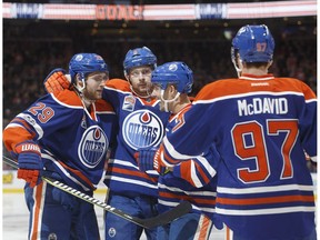 Edmonton Oilers' Leon Draisaitl (29), Adam Larsson (6) Andrej Sekera (2) and Connor McDavid (97) celebrate a goal against the New Jersey Devils in Edmonton, on Jan. 12, 2017. (The Canadian Press)