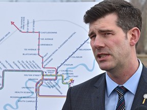 Mayor Don Iveson, with a map of future and current LRT routes in back, pushes for a five-year provincial LRT funding plan.