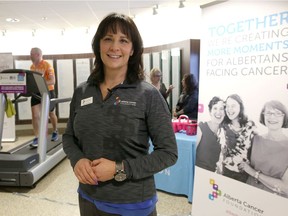 Myka Osinchuk, CEO of the Alberta Cancer Foundation and others take part in an event at the Tom Baker Cancer Centre in Calgary, Alta., on Friday Feb. 3, 2017, in support of World Cancer Day and to get people to participate in the 2017 Ride to Conquer Cancer and OneWalk.