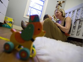 Julia Lipscombe and her son Indiana Lipscombe pose for a photo in their Edmonton home, Thursday Feb. 2, 2017.