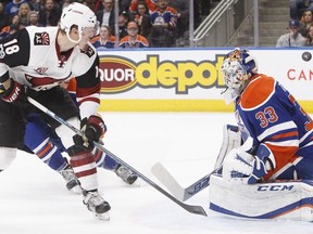 Arizona Coyotes centre Christian Dvorak (18) gets a shot on Edmonton Oilers goalie Cam Talbot (33) during first period NHL action in Edmonton, Alta., on Tuesday February 14, 2017.