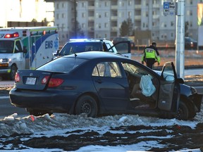 Police investigate a collision between two vehicle on 144 Ave. which they closed and Ebbers Rd. in north Edmonton, Friday, January 20, 2017.