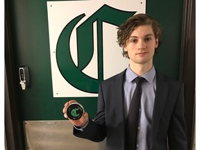 Sherwood Park Crusaders goalie Jake Morrissey holds the puck he used to score a last-second goal in a 3-1 win over the Camrose Kodiaks at the Sherwood Park Arena on Friday, Feb. 17, 2017. (Supplied)