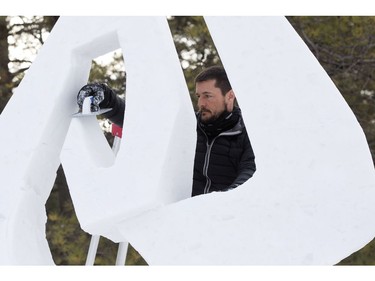 Team France's David Marchelli works on a snow sculpture during the Silver Skate Festival in Hawrelak Park, in Edmonton Sunday Feb. 12, 2017. Photo by David Bloom