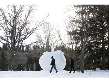 Visitors to the Silver Skate Festival in Hawrelak Park walk past a snow sculpture, In Edmonton Sunday Feb. 12, 2017. Photo by David Bloom