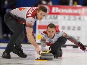 Skip Brendan Bottcher, throws a rock as second Bradley Thiessen sweeps at the 2017 Alberta Boston Pizza Cup men's curling championship in Westlock,on Wednesday February 8, 2017.