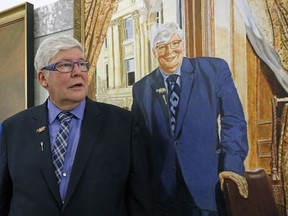 The official portrait of former Alberta Premier David Graeme Hancock, Alberta's 15th Premier, painted by artist Tom Menczel, was unveiled at the Alberta Legislature on Monday, February 13, 2017. In this photo Dave views the portrait after it was hung on the walls of the Legislature beside former Premiers of the province.