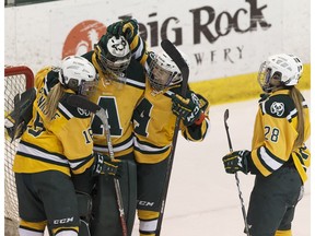 The U of A Pandas celebrate beating the Manitoba Bisons during the first Canada West semi-final game at Clare Drake Arena at the University of Alberta in Edmonton on Friday, February 24, 2017.