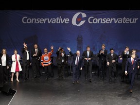 Thirteen of 14 candidates wave at the conclusion of the Conservative Party of Canada leadership debate in Edmonton on Tuesday, February 28, 2017.