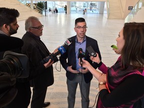 Sean Lee, a member of the Edmonton Transit advisory committee, speaking to reporters at City Hall  on Feb. 13, 2017.