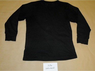 A police photograph of a shirt worn by Jayme Paseika and seized by Edmonton police following his arrest as the only suspect in a deadly mass stabbing in an Edmonton warehouse on Feb. 28, 2014. The photograph was entered as an exhibit in Pasieka's jury trial on Feb. 21, 2017.