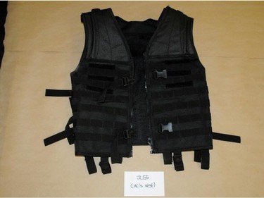 A photograph of a black vest Edmonton police allegedly seized from Jayme Pasieka on the day of a stabbing spree at a west Edmonton warehouse on February 28, 2014.