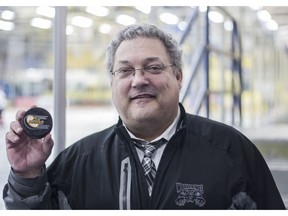 Whitecourt Wolverines head coach Gord Thibodeau shows off the game puck from his 833rd Alberta Junior Hockey League win at the Casman Centre in Fort McMurray Alta. on Friday February 3, 2017. Thibodeau passed Don Phelps's mark of 832 AJHL wins Friday with the Wolverines 2-1 overtime win over the Fort McMurray Oil Barons, making him the winningest coach in league history.