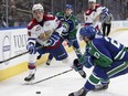 Edmonton Oil Kings' Graham Millar (34) battles Swift Current Broncos' Max Lajoie (27) at Rogers Place in Edmonton on Sunday, March 5, 2017. (Ian Kucerak)