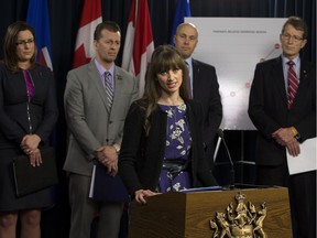 Rosalind Davis speaks about her partner Nathan Huggins - Rosenthal, who died Feb 17, 2016 from an opioid overdose, at the Alberta Legislature in Edmonton Monday, March 6, 2017. Davis was taking part in a joint press conference with (left to right) the Wildrose's Angela Pitt, the Progressive Conservative's Mike Ellis, Alberta Party's Greg Clark, and the Alberta Liberal's Dr. David Swann, calling on the government to take immediate action to address the current opioid crisis.