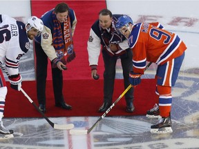 WINNIPEG, MANITOBA - OCTOBER 23: Wayne Gretzky (L) and Dale Hawerchuk drop the puck in a ceremonial face-off between Blake Wheeler #26 and Connor McDavid #97 during the 2016 Tim Hortons NHL Heritage Classic hockey game on October 23, 2016 at Investors Group Field in Winnipeg, Manitoba, Canada.
