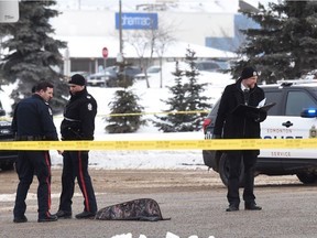 A long gun lies beside its case in the intersection of 50 St. And 137 Ave in north Edmonton on March 13, 2017.