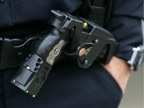 A police officer's holstered Taser X26 stun gun.