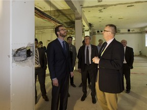 Advanced Education Minister Marlin Schmidt and University of Alberta vice-president Andrew Sharman inspect a floor in the dentistry and pharmacy building after an infrastructure investment of $149 million was announced on March 22, 2017 in Edmonton.