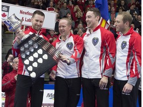 Newfoundland and Labrador's Brad Gushue, left, Mark Nichols, Brett Gallant and Geoff Walker hold the Brier Tankard after defeating Team Canada 7-6 to win the Tim Hortons Brier at Mile One Centre in St. John's on Sunday, March 12, 2017. (Andrew Vaughan/The Canadian Press)