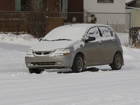 A car that may have been used in a road rage incident on Tuesday morning sits near the corner of 71 Street and 91 Avenue on Wednesday, March 8, 2017 in Edmonton.