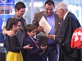 Cal Nichols hands out citizenship certificates to the Bubevski family: Zoran (father), Renata (mother), Veda (daughter) and Davian (son). The family, originally from Macedonia, took their citizenship oath on Saturday, March 18, 2017 at Rogers Place.