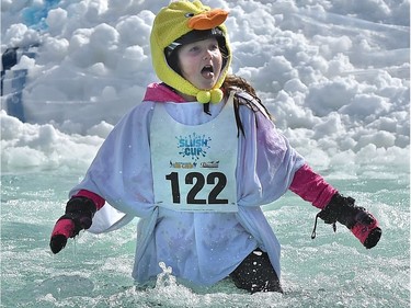 Citrine Boychuk, 9, reacts after sinking in the water during the annual Slush Cup festival at the Edmonton Ski Club on Saturday, March 18, 2017.