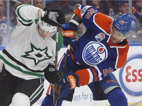 Dallas Stars' Cody Eakin (20) and Edmonton Oilers' Darnell Nurse (25) vie for the puck during third period NHL action in Edmonton, Alta., on Tuesday, March 14, 2017.