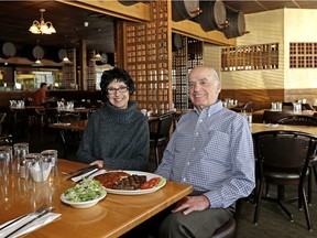 Coliseum Steaks and Pizza  co-owners Dimitra Scordas (left) and Peter Varvis (right) at their restaurant which has been in business in Edmonton for the past 40 years.