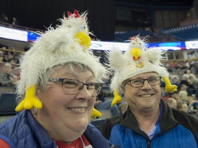 Dee and Grant Hopley of Nipiwin Saskatchewan. Hardcore curling fans watch the first day of curling at the Mens's World Curling Championships at Northlands Coliseum on April 1, 2017. Photo by Shaughn Butts / Postmedia