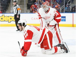 Ryan Sproul of the Detroit Red Wings calls for a trainer after being injured against the Edmonton Oilers on March 4, 2017 at Rogers Place in Edmonton. (Codie McLachlan/Getty Images)